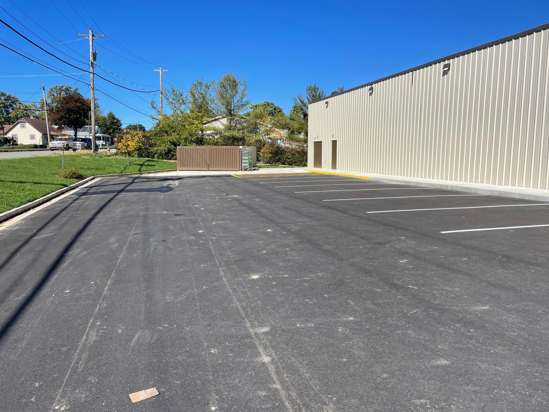 A parking lot with a building in the background