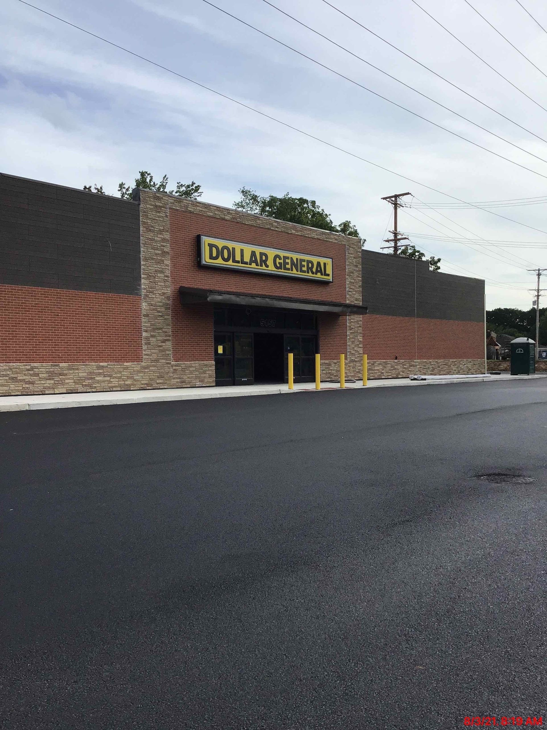The outside of a dollar general store on a cloudy day