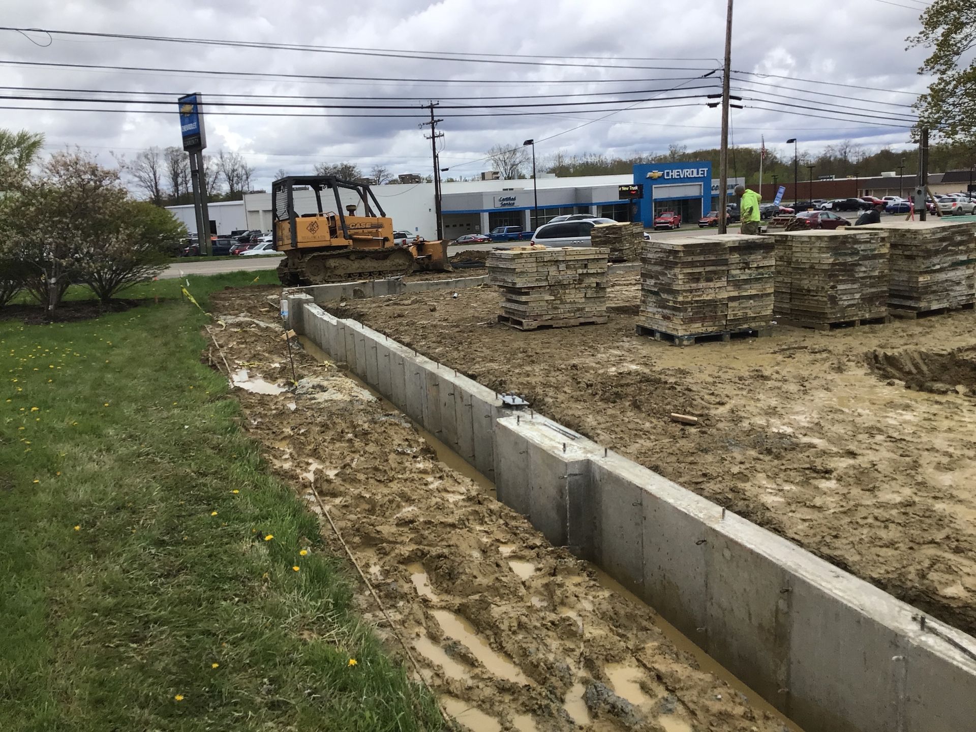 A construction site with a bulldozer in the middle of it