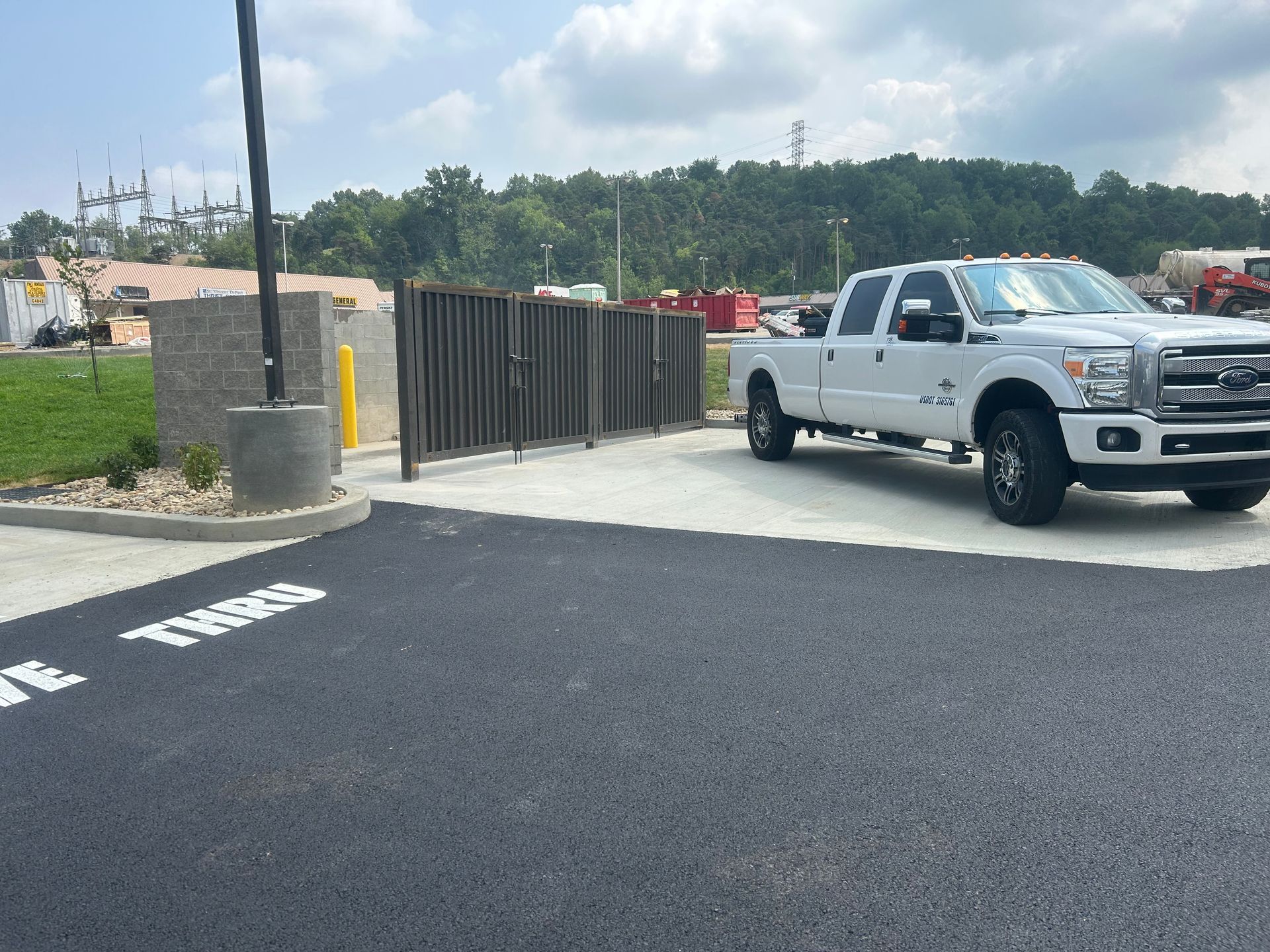 A large white truck is parked in a parking lot