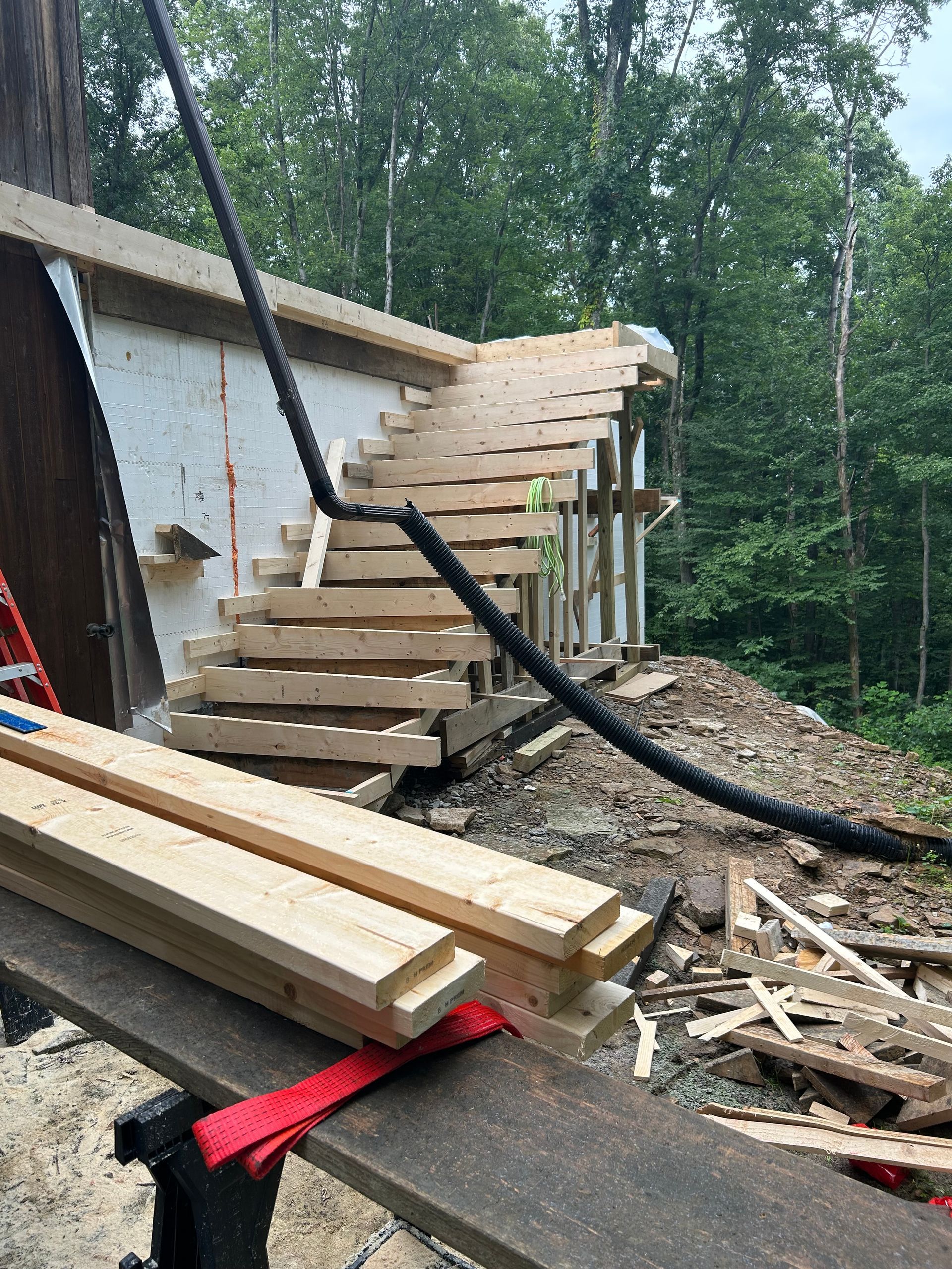 A pile of wood is sitting on top of a wooden table.