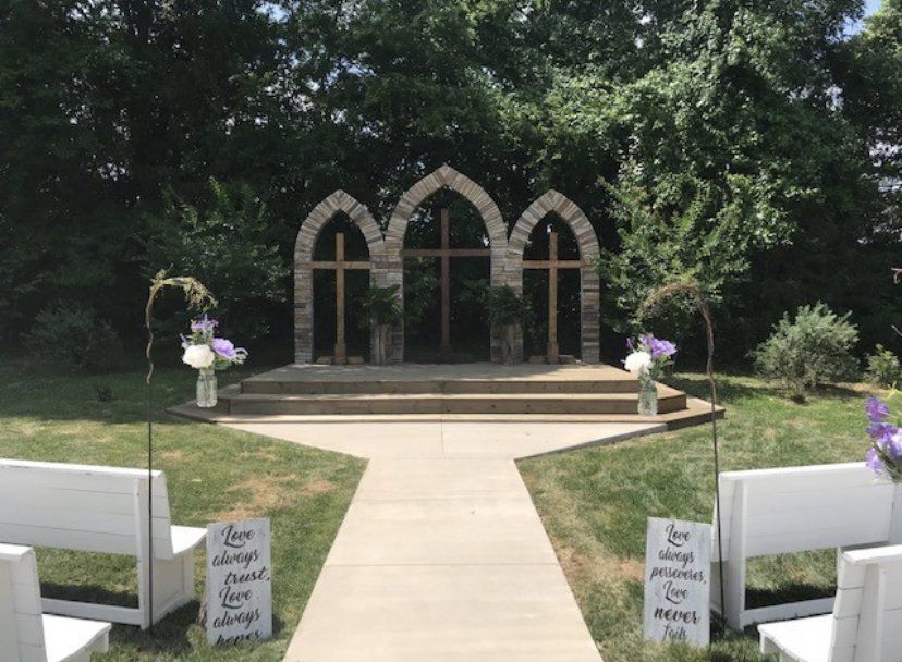 A wedding ceremony is taking place in front of a church.