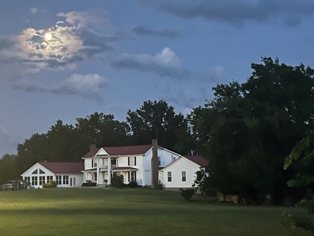a white house with a red roof 