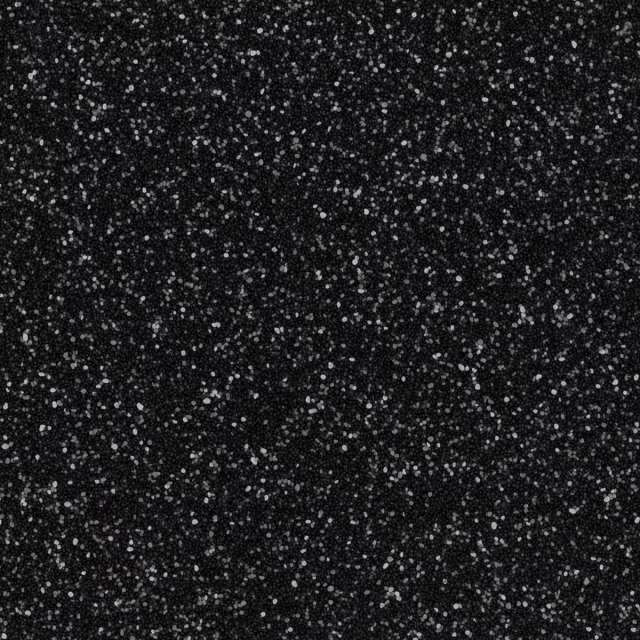 Black speckled textured surface with scattered white flecks
