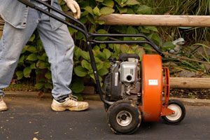 Man pushing leaf blower