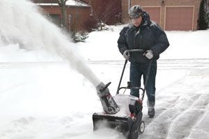 Man using a snow blower