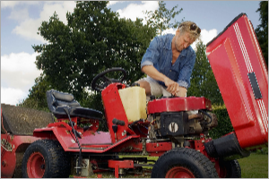 Lawn mower being fixed with tools