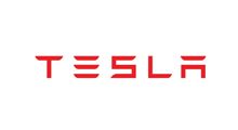 Red Tesla wordmark logo on a white background