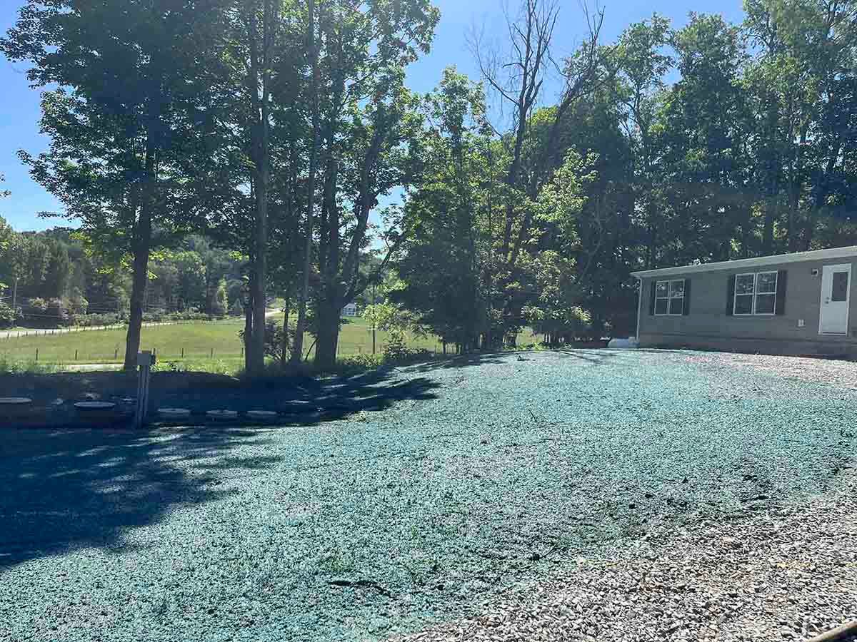 A wide yard under hydroseeding process