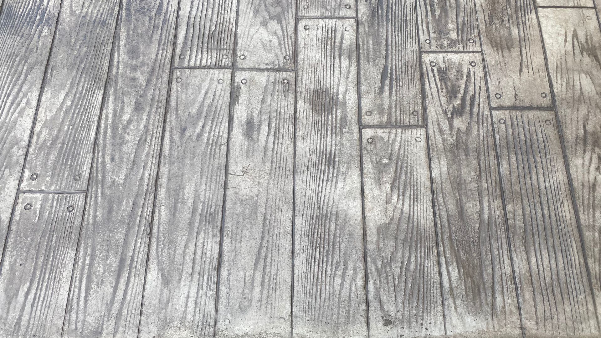 Gray weathered wooden floorboards with visible grain and plank seams