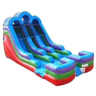 Colorful inflatable double slide with blue, green, red, and purple lanes and landing pads
