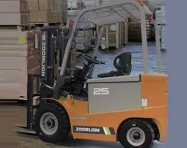 Orange and gray forklift parked in a warehouse aisle near stacked boxes