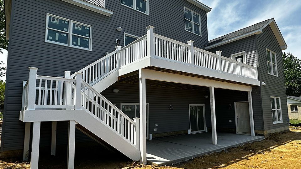 The back of a house with a deck and stairs