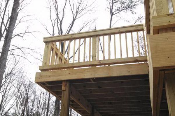The back of a house with a deck and stairs