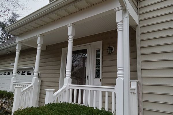 A house with a porch and a white railing