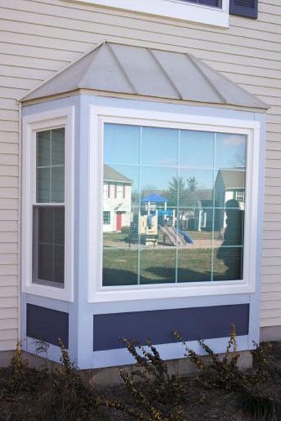 A bay window on the side of a house