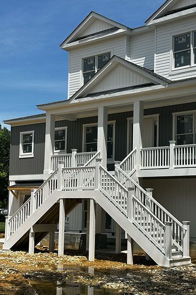 A large house with stairs leading up to the second floor