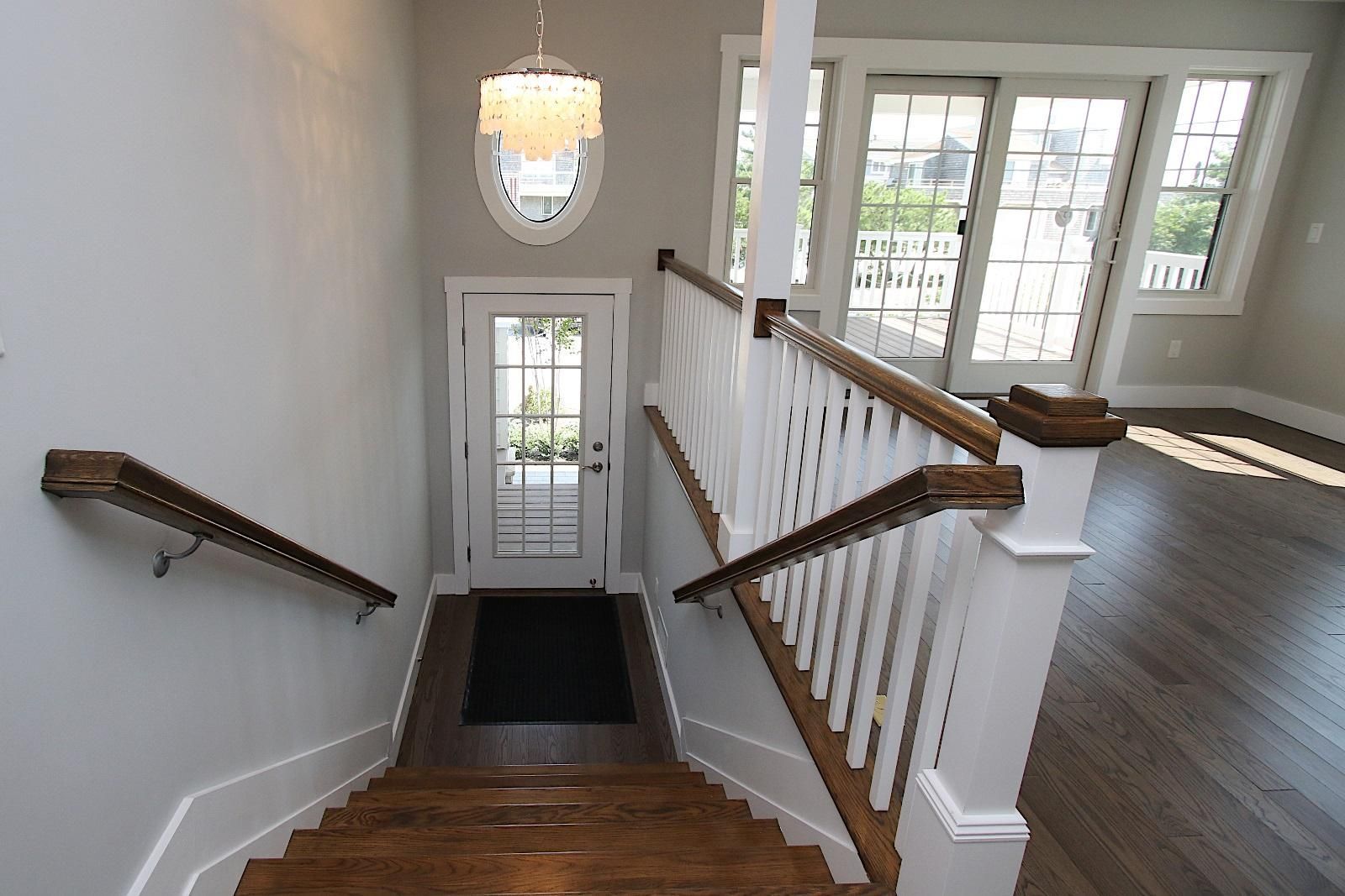 a set of stairs leading up to a door in a house