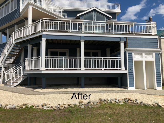 a picture of a house with a deck and stairs says after