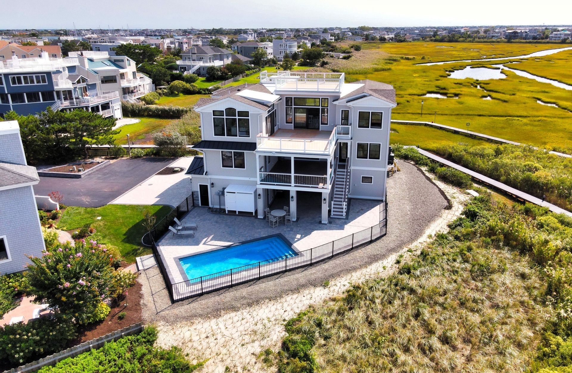 an aerial view of a large house with a swimming pool
