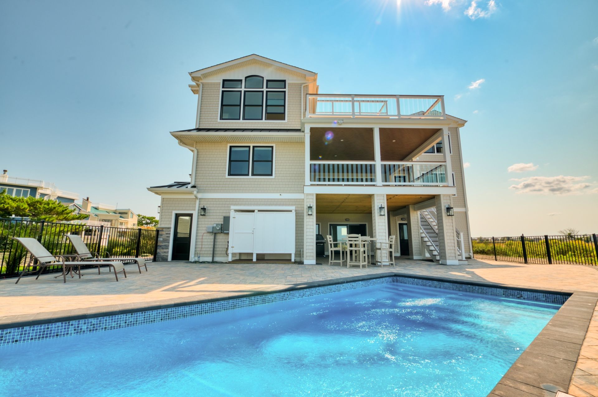 a large house with a swimming pool in front of it .