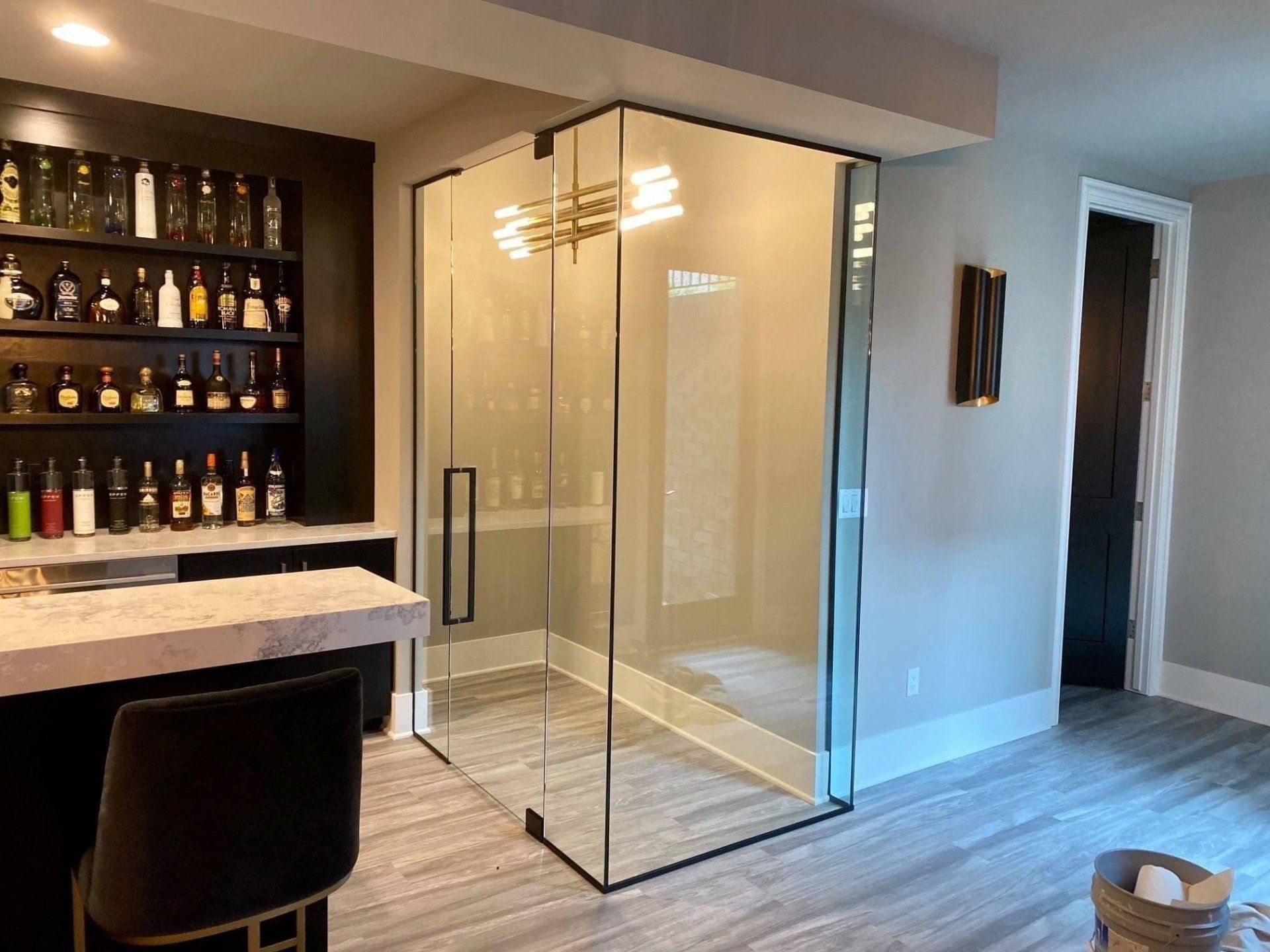 Bar room with a small space built with interior glass walls and door