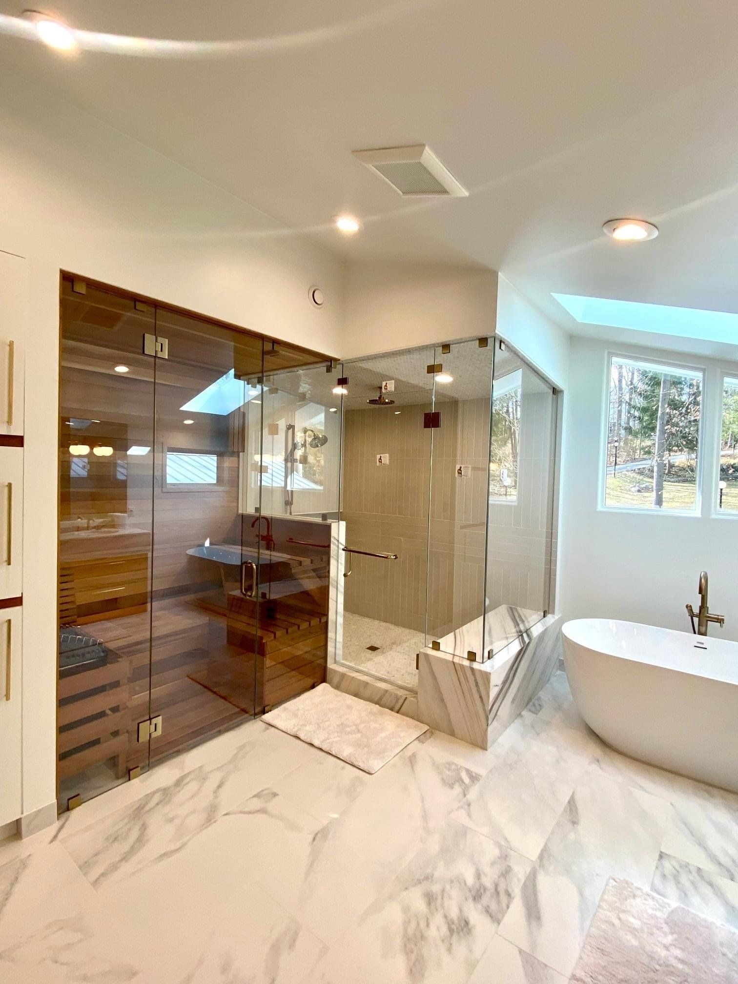 Luxurious bathroom with shower and sauna enclosed in glass doors
