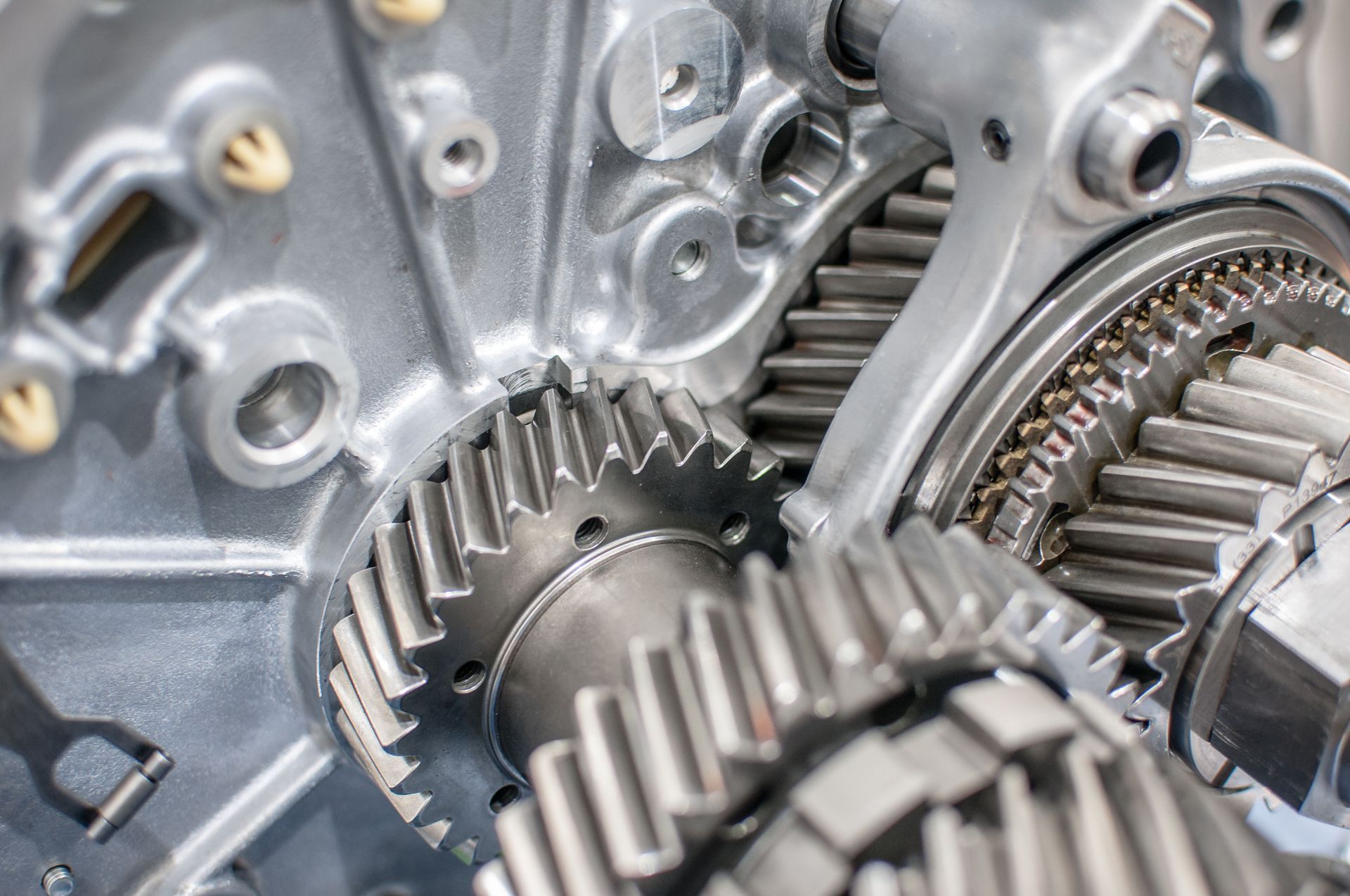 Close-up of interlocking metal gears in a machine gearbox.