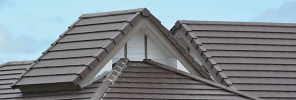 a close up of a roof with a window on it