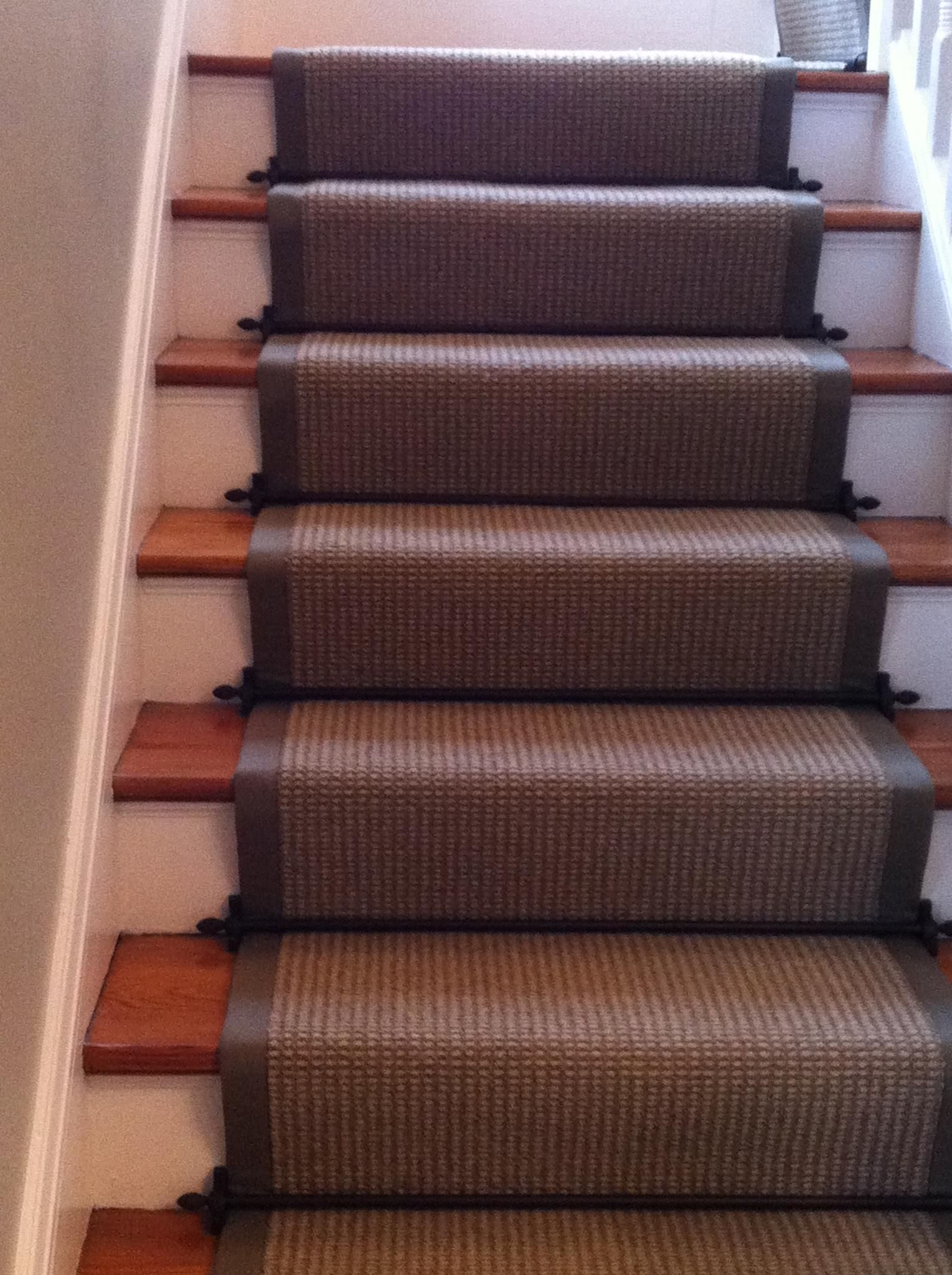 A set of stairs with a carpet on them