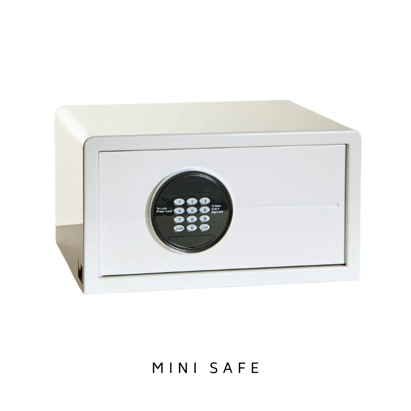 White mini safe with digital keypad on the front, isolated on a white background