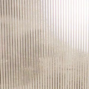 Abstract beige surface with vertical striped texture and a bright white area on the right