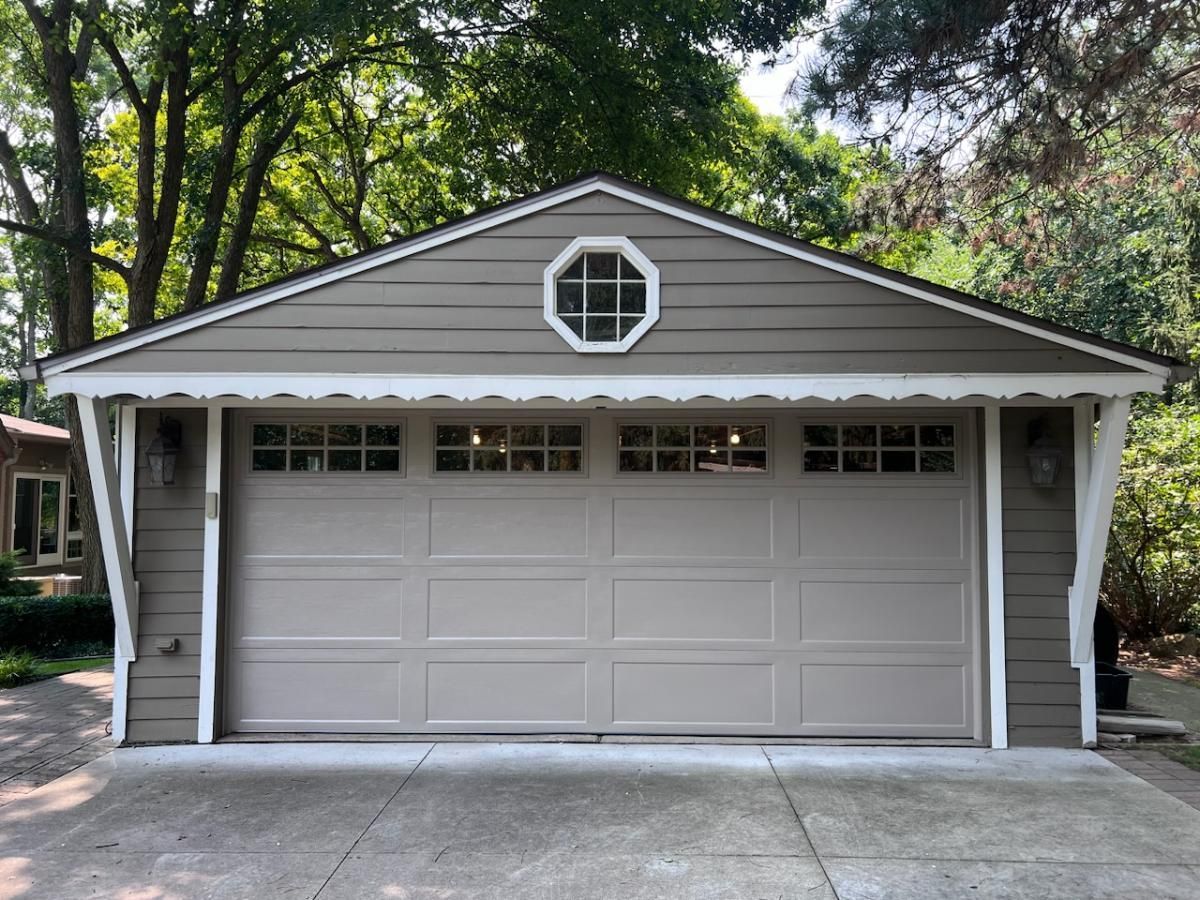 A garage with a window on the top of it.