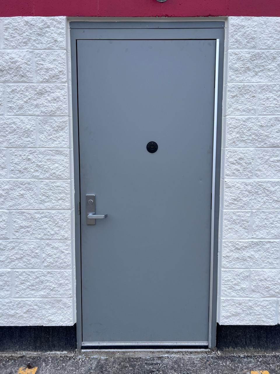 A gray door hollow metal door
