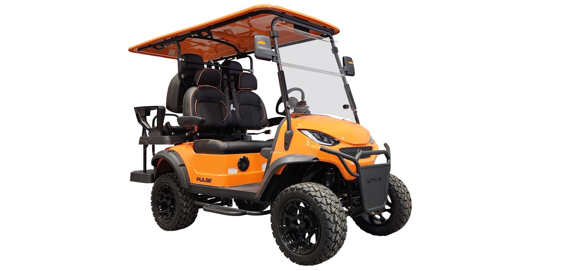 An orange golf cart with a canopy on top of it on a white background.