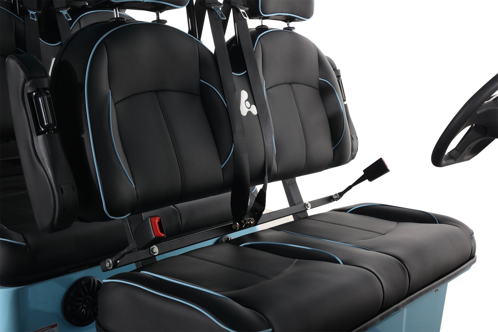 A golf cart with black seats and a steering wheel
