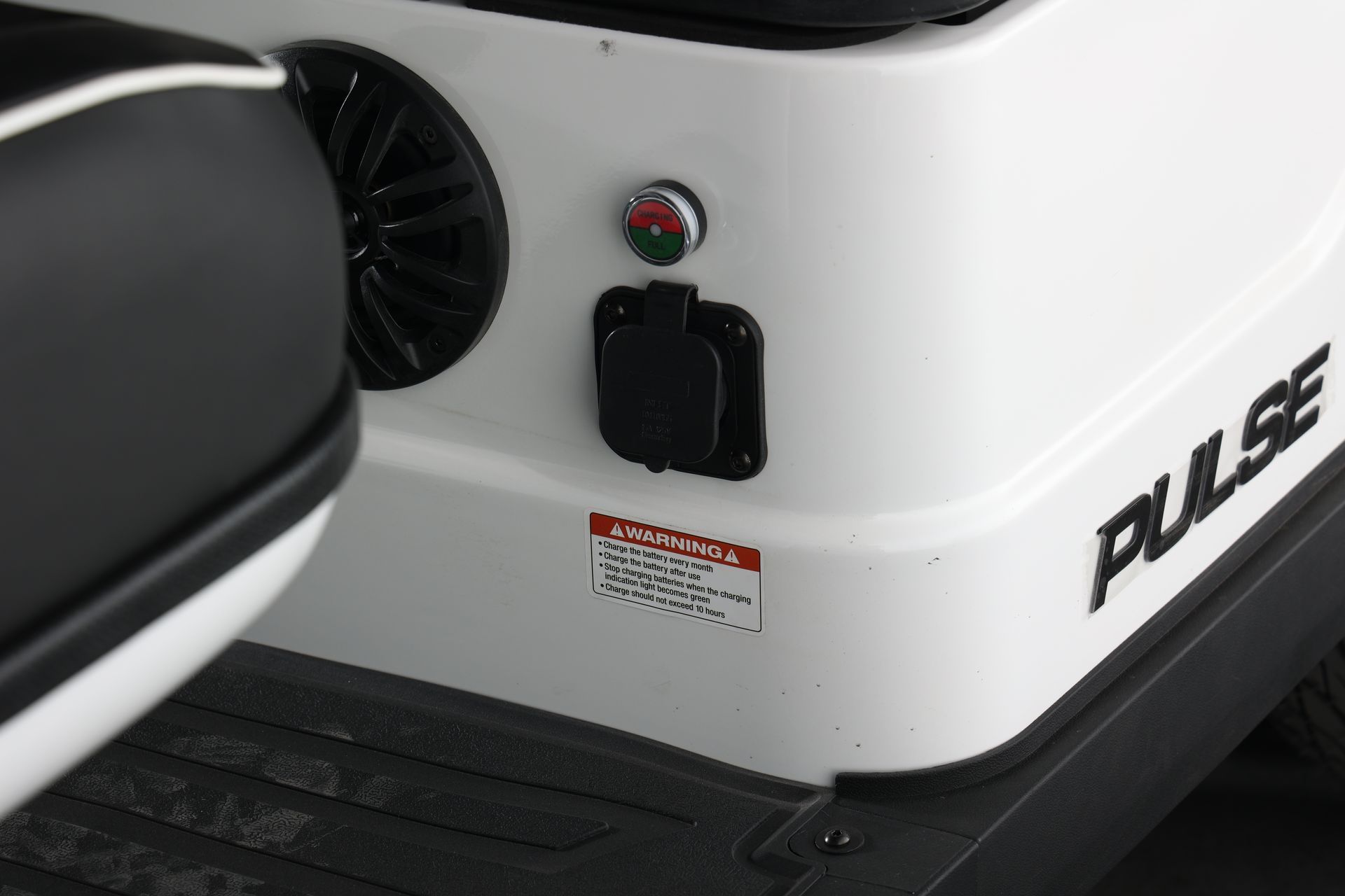 A white golf cart with the word pulse on it