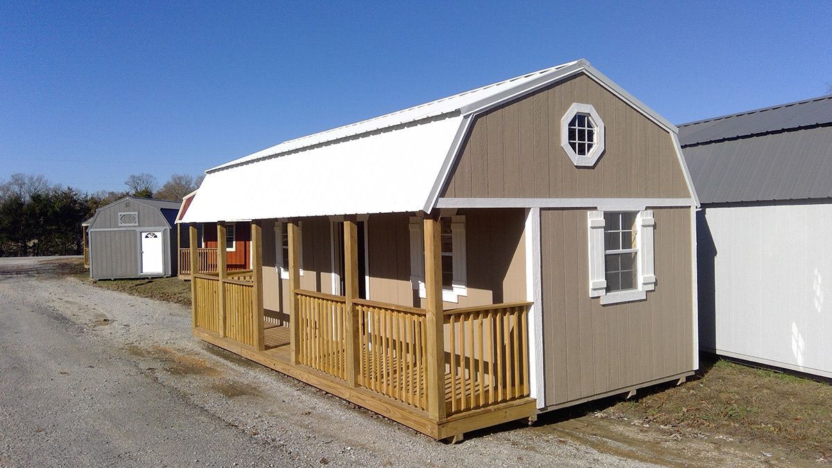 A barn shed with a porch and a window