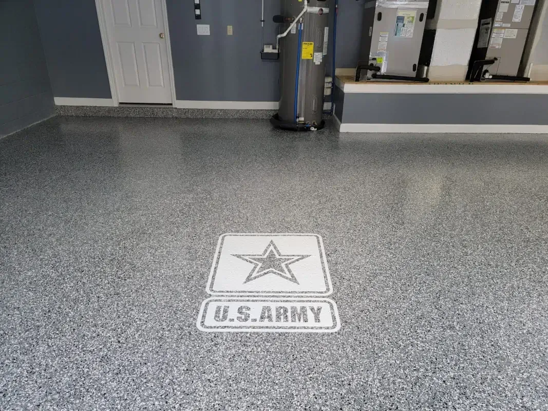 Gray speckled floor with a U.S. Army star logo decal in a hallway or lobby.