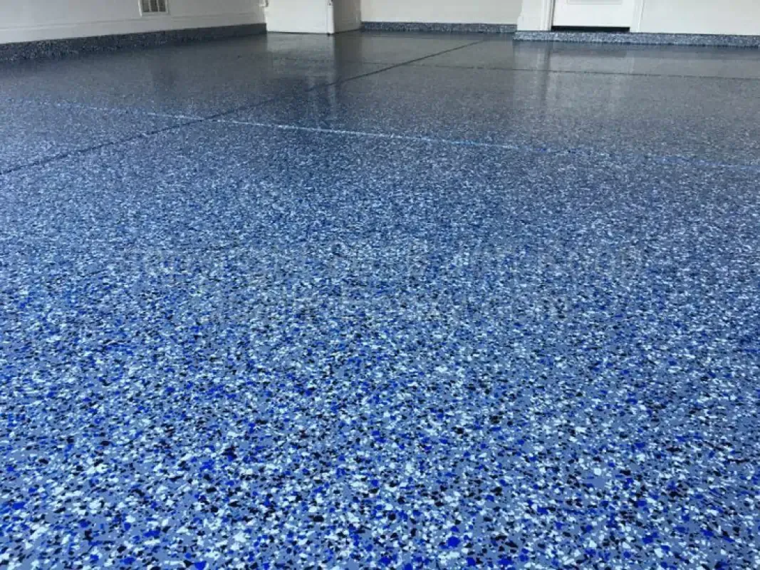 Blue speckled epoxy floor in an empty room