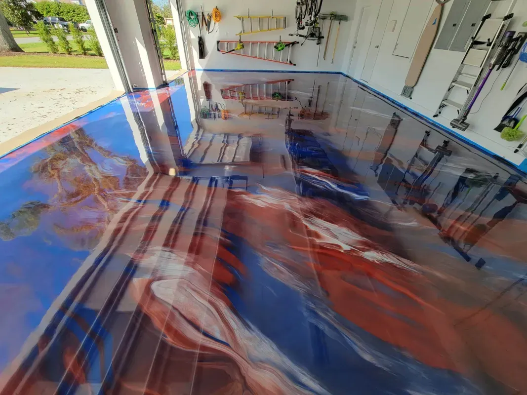 Colorful indoor playroom with a glossy red, blue, and white floor and wall-mounted play equipment
