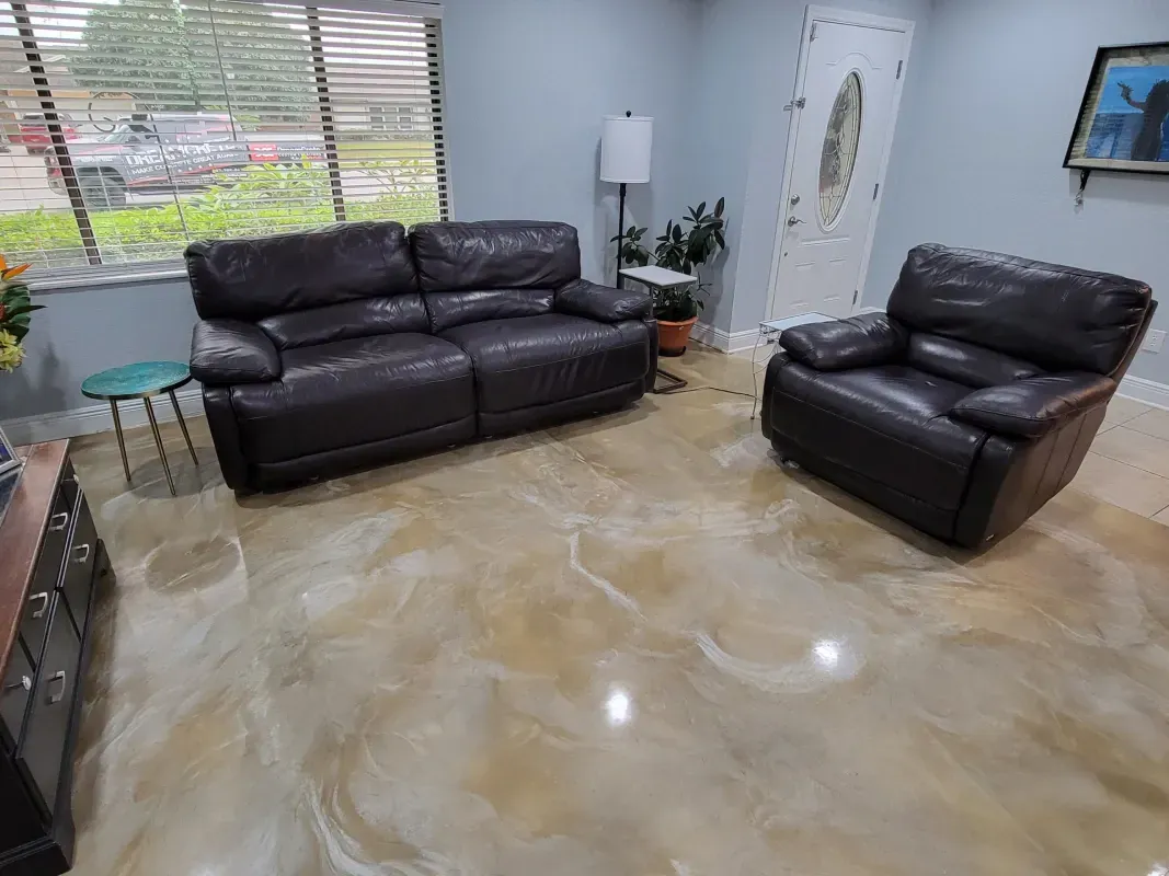 Living room with black leather sofa set, glass side table, floor lamp, and shiny marble floor