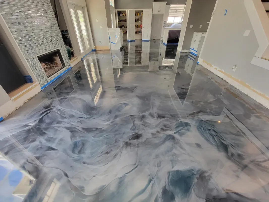 Stylish living room with a glossy gray marbled floor, fireplace, and stone accent wall.