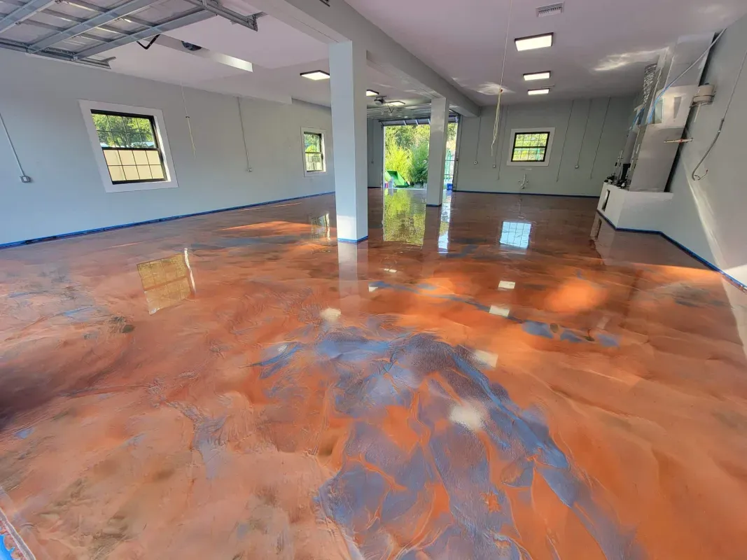 Empty room with glossy orange floor, white walls, windows, and ceiling lights reflection