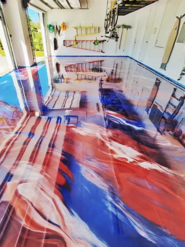 Abstract red, blue, and white painted floor in a bright hallway with white walls and benches
