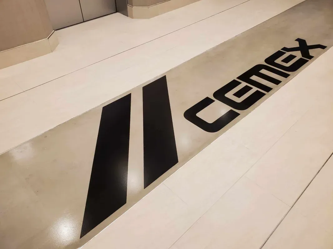 White surface with black diagonal stripes and the word “comix” printed on it.