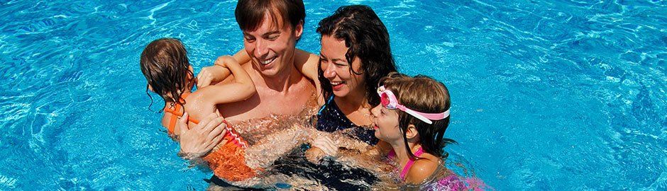 Happy family in pool