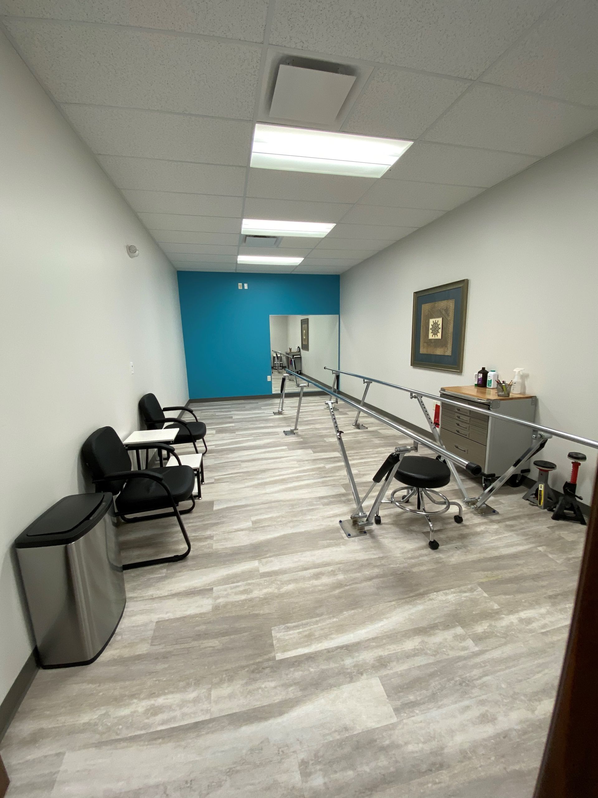 A large room with a lot of furniture and a mirror.