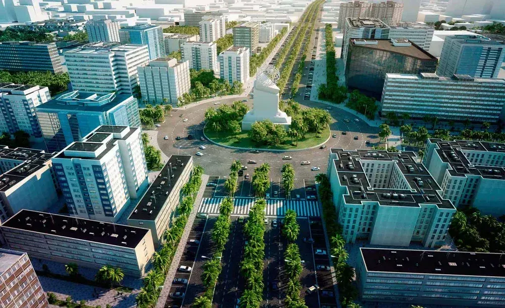 Aerial view of a modern city with tall buildings, a central monument, and a roundabout with roads leading out.