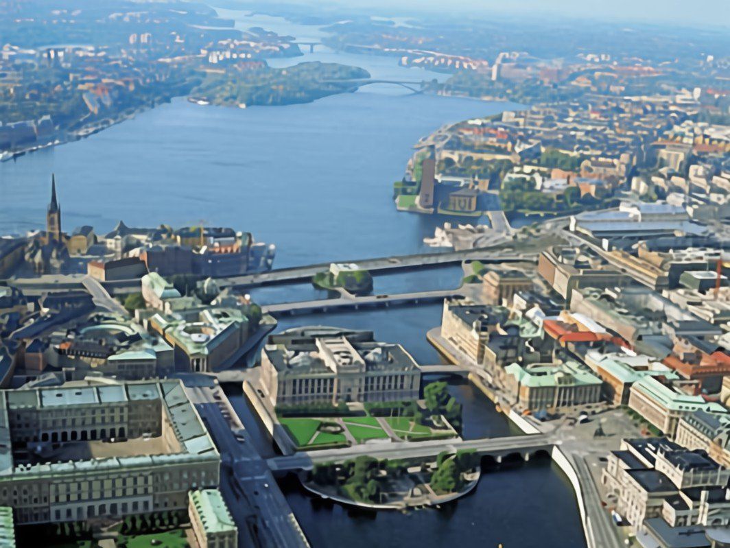 Aerial view of Stockholm, Sweden, with bridges, buildings, and waterways under a blue sky.